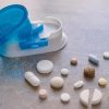 Pivotell Pill Splitter with examples of pills split next to it