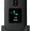 Back of a phone in a docking cradle with the screen reading 'Call Anne' and a green call icon visible on the display.