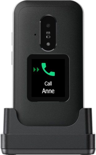 Back of a phone in a docking cradle with the screen reading 'Call Anne' and a green call icon visible on the display.